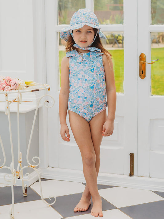 Light blue floral petal-collar sleeveless one-piece swimsuit on standing child