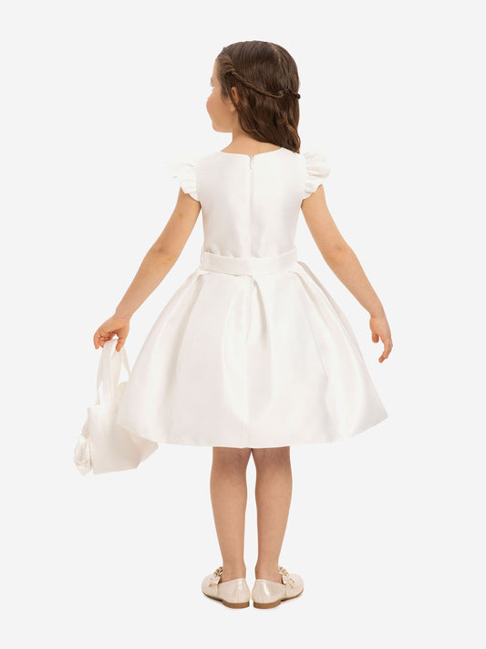 Back view of girls white dress with bow waist and floral tote bag