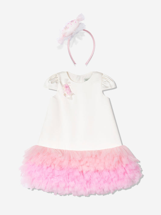 Ivory dress with puff sleeves, pink tulle skirt, and matching bow headband