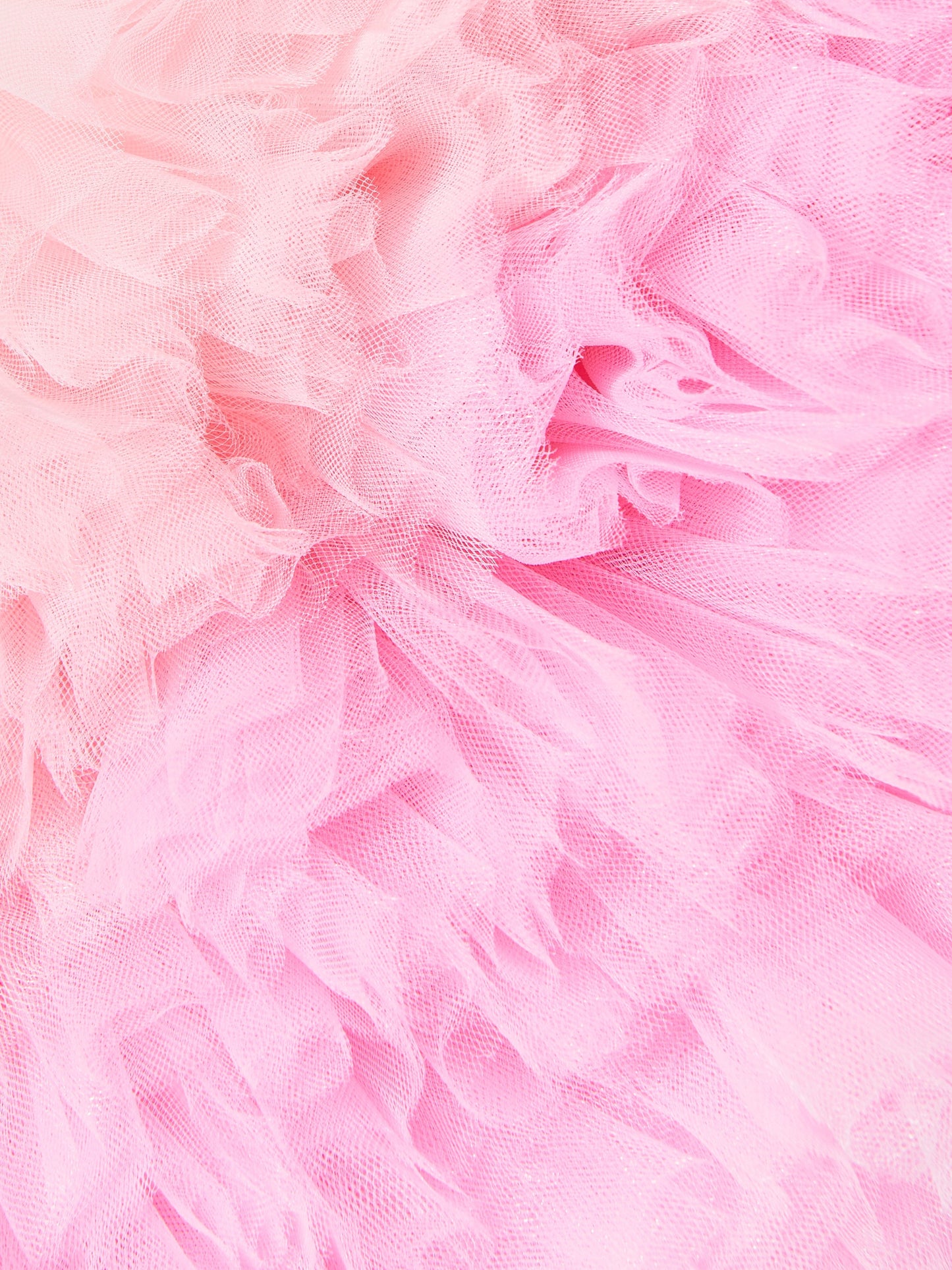Pink tulle ruffle close-up with layered, airy texture