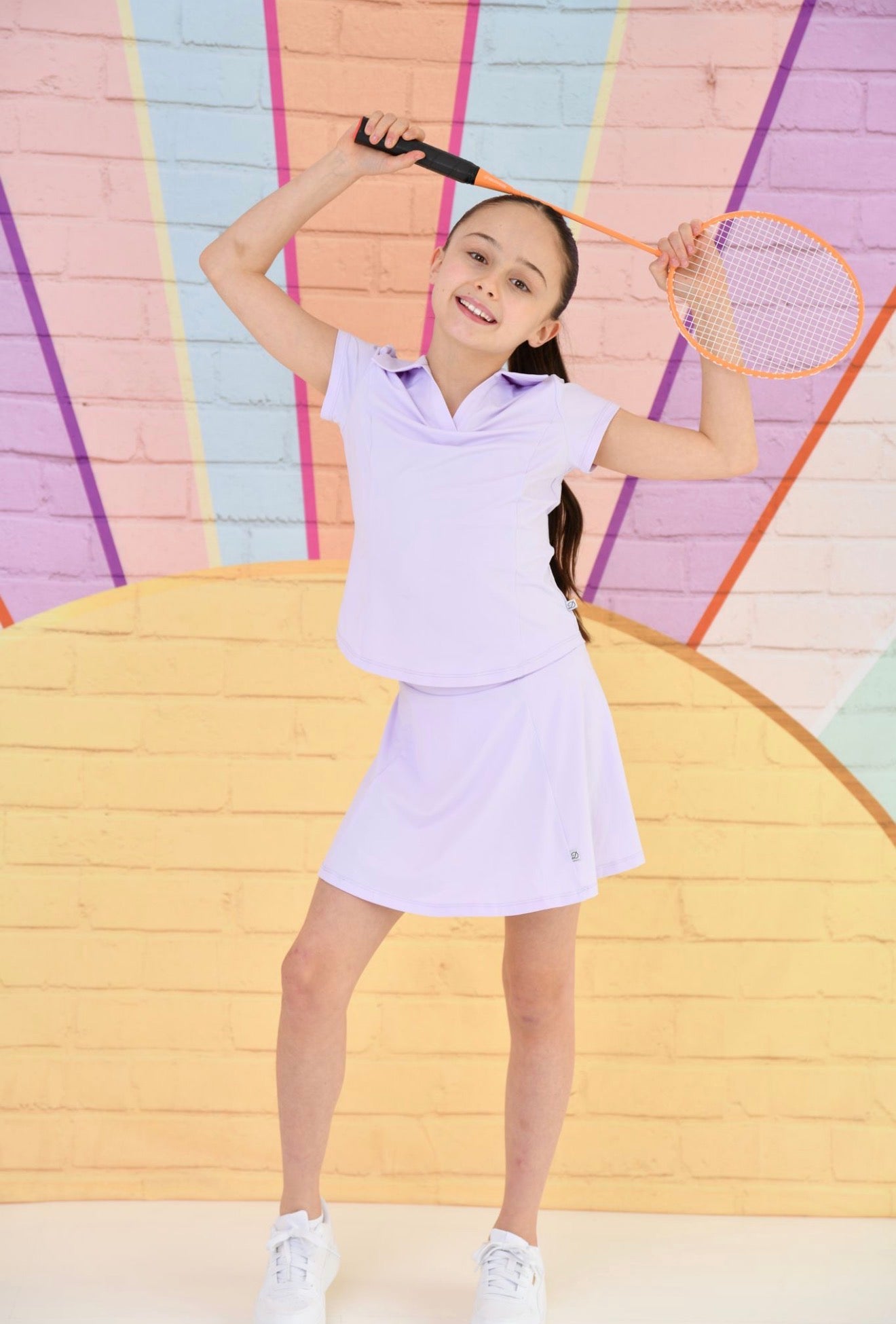 Lilac collared polo top and skirt-style skort set for active tennis days