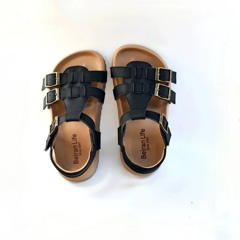 Kids black leather sandals with buckle straps and open-toe design