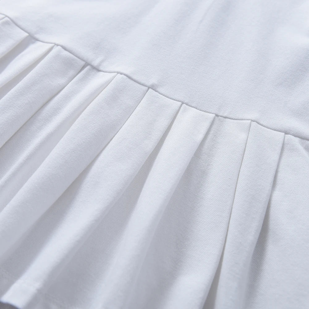White pleated skirt detail for girls polo tennis dress, soft gathered fabric folds