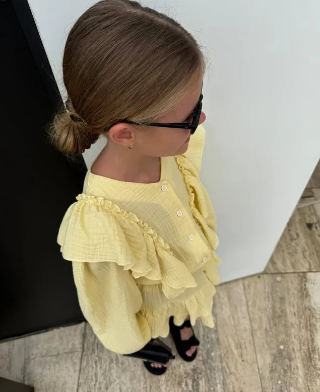 Lemon ruffle smock shirt with layered skirt, side view