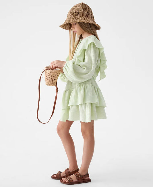 Mint green ruffle smock shirt and tiered skirt set in side view, layered skirt