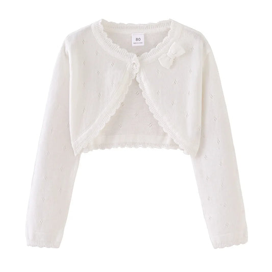 White toddler knit cardigan with bow detail at neckline and scalloped trim