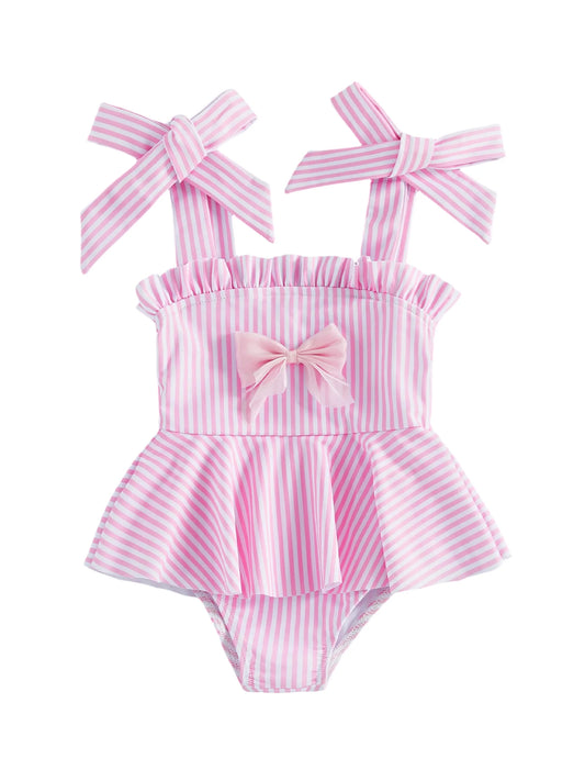 Girls pink striped swimsuit with ruffled neckline, bow straps, and peplum skirt