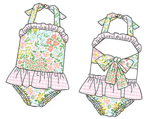 Girls floral swim suit with bow tie straps, ruffle skirt, and matching briefs