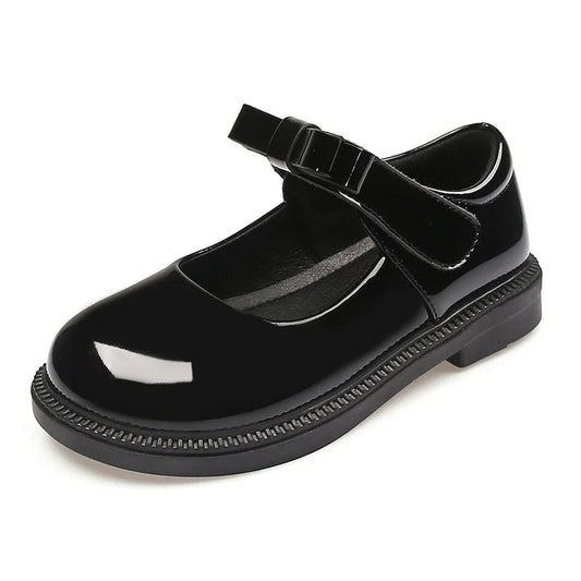 Black shiny shoe with a strap on a white background