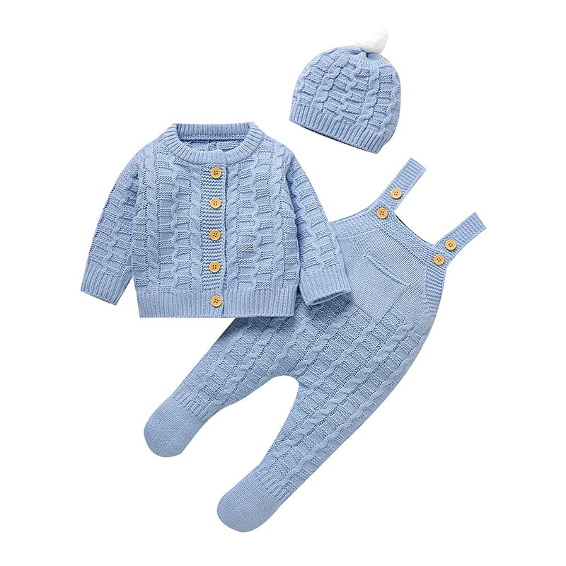 Blue knitted baby outfit set with button cardigan, romper, and pom-pom hat