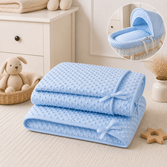 Light blue dimple moses basket bedding set with folded quilt and matching bumper ties
