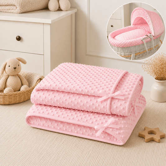 Pink moses basket bedding set: folded quilt and matching hood fabric with ribbon ties