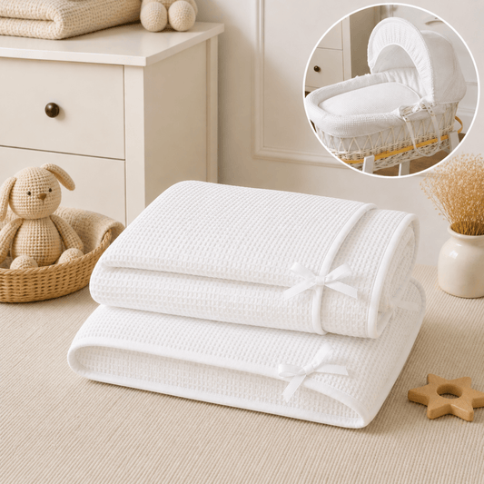 White waffle moses basket quilt bedding set, folded with ribbon ties