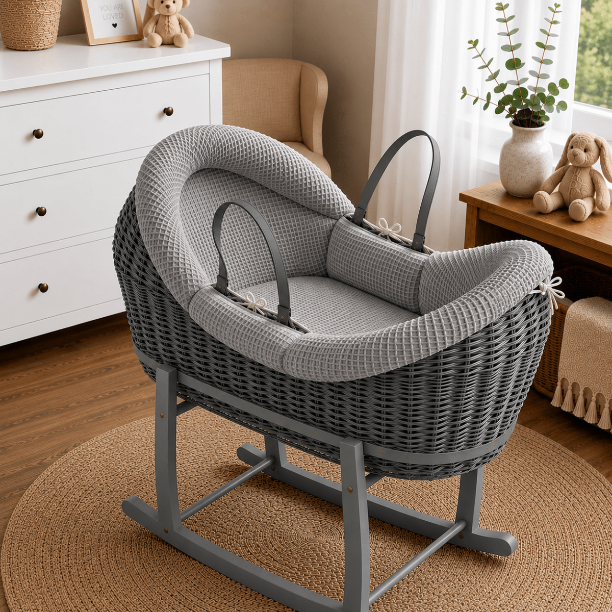 Wicker Moses basket with stand, light grey textured bedding and padded hood