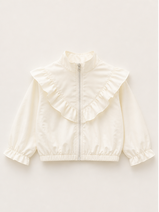 Cream-colored jacket with ruffled details on a white background, worn by a child outdoors.