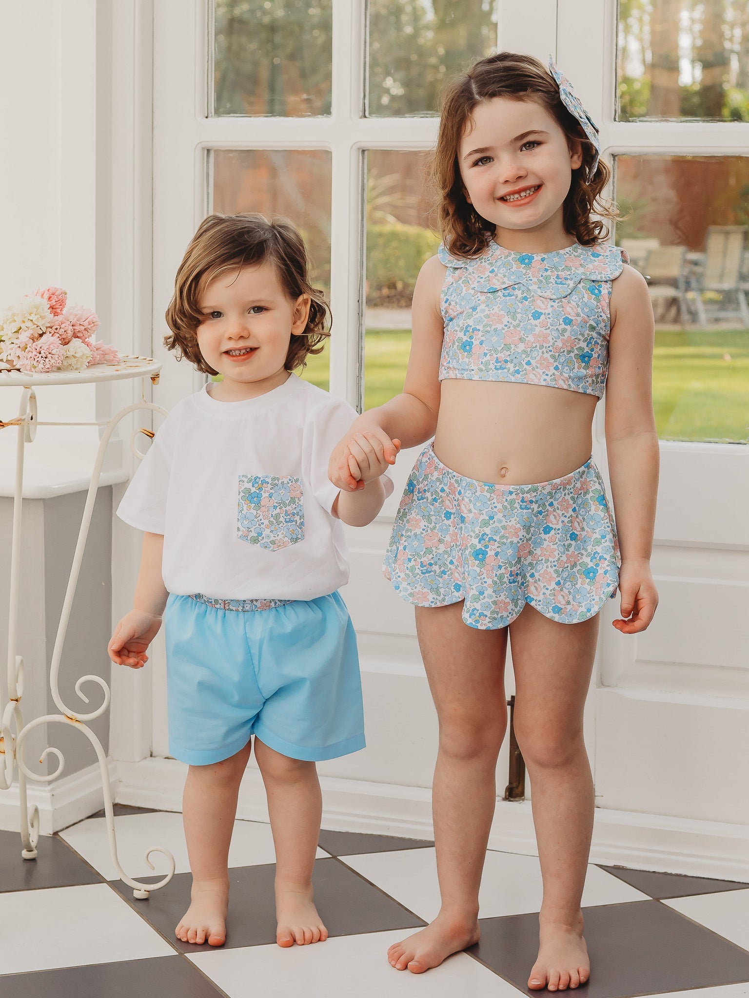 Light blue R&A 'Betsy' boys swimshort with elastic waistband and scalloped hem
