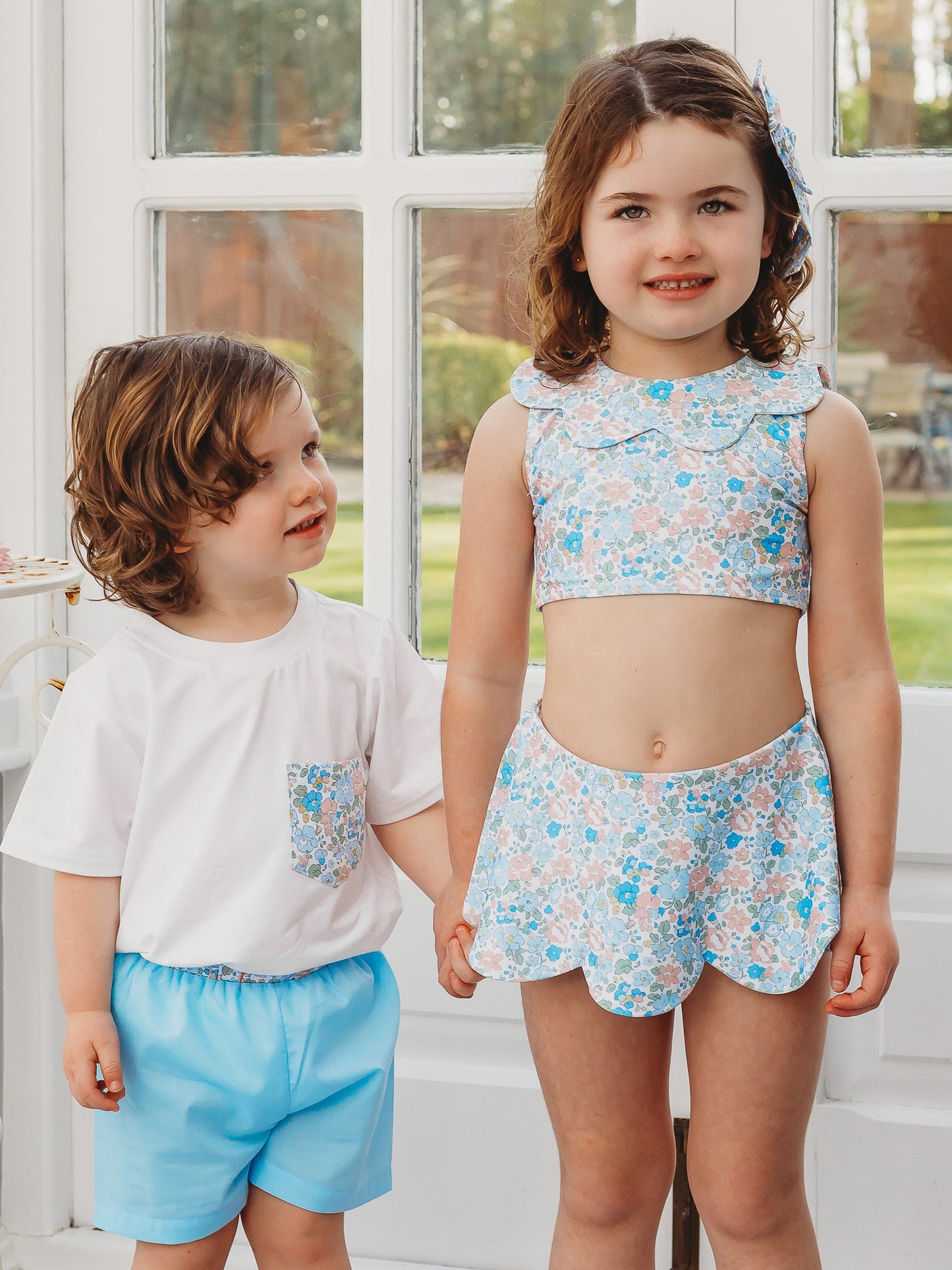Boys white pocket T-shirt with a colorful floral-print chest pocket