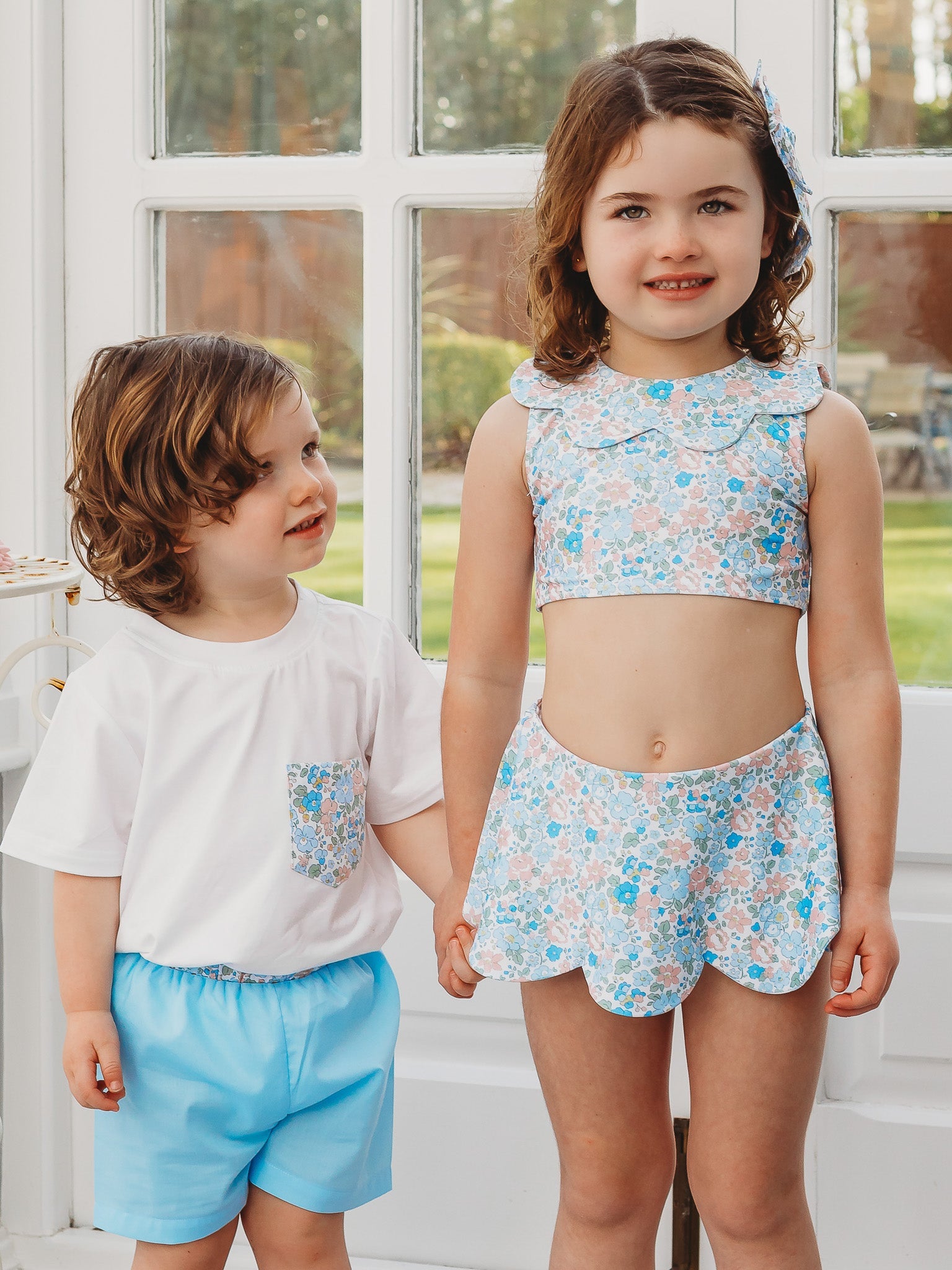Light blue R&A 'Betsy' boys swimshort with elastic waistband and above-knee length