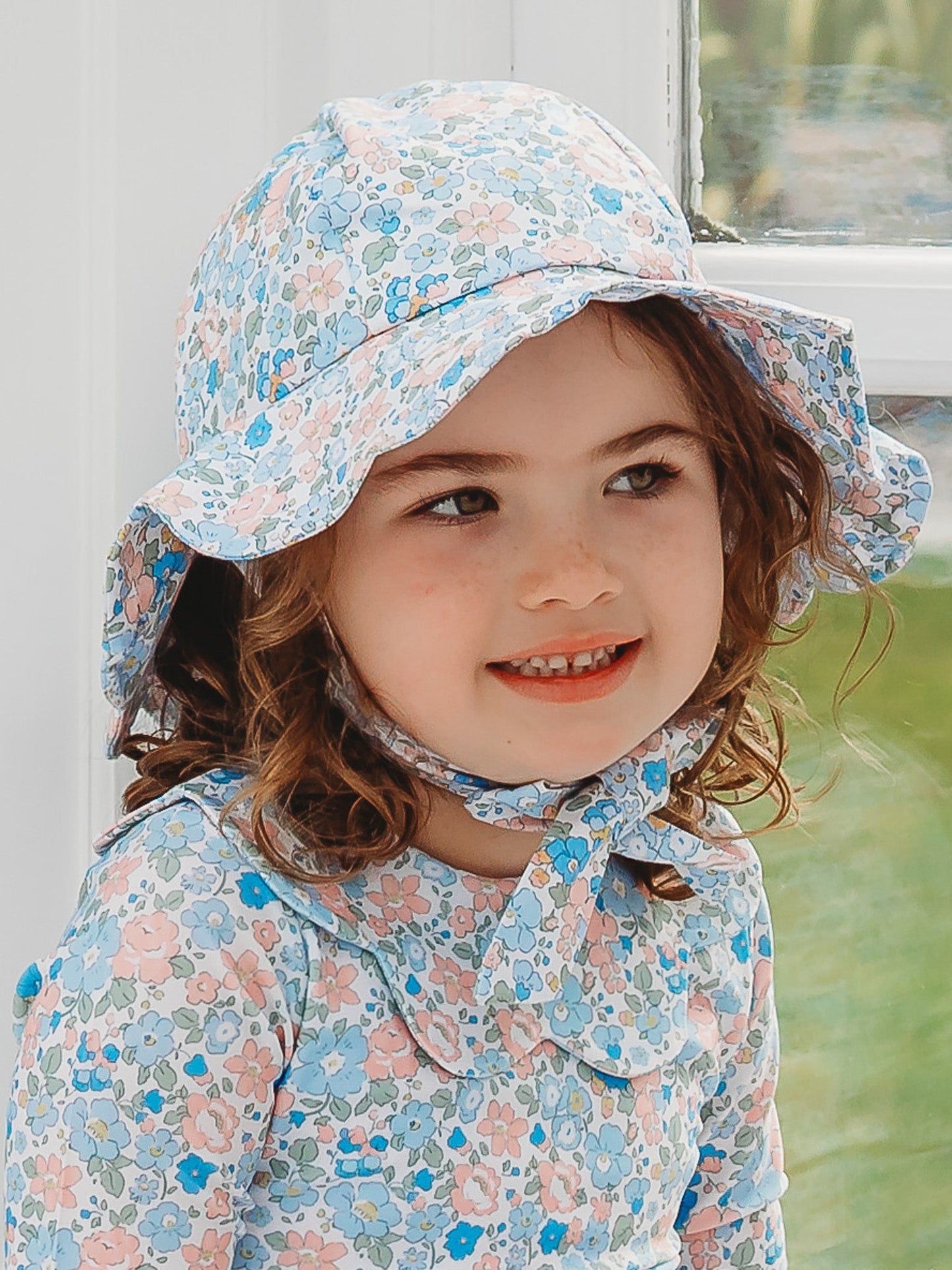 Floral light blue petal sunhat with wide brim and neck tie