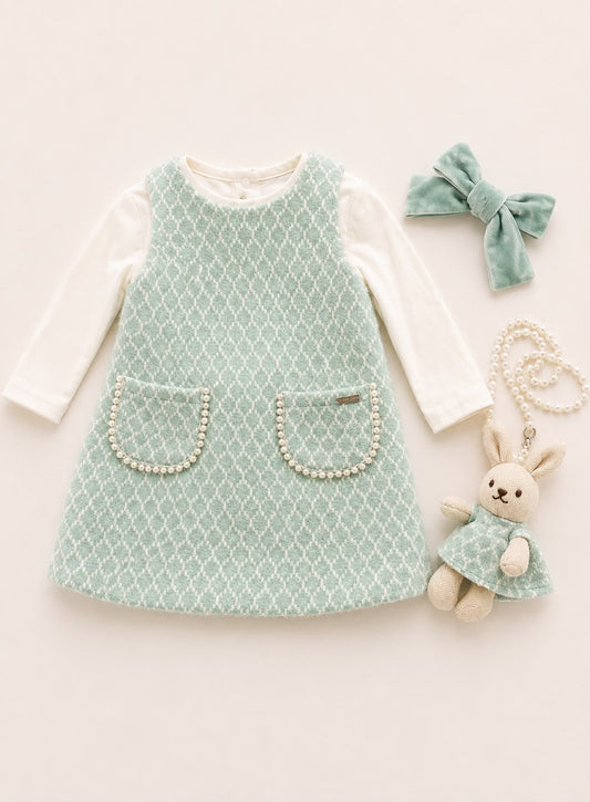 Girls mint green knitted pinafore dress over white long-sleeve top, with two front pockets