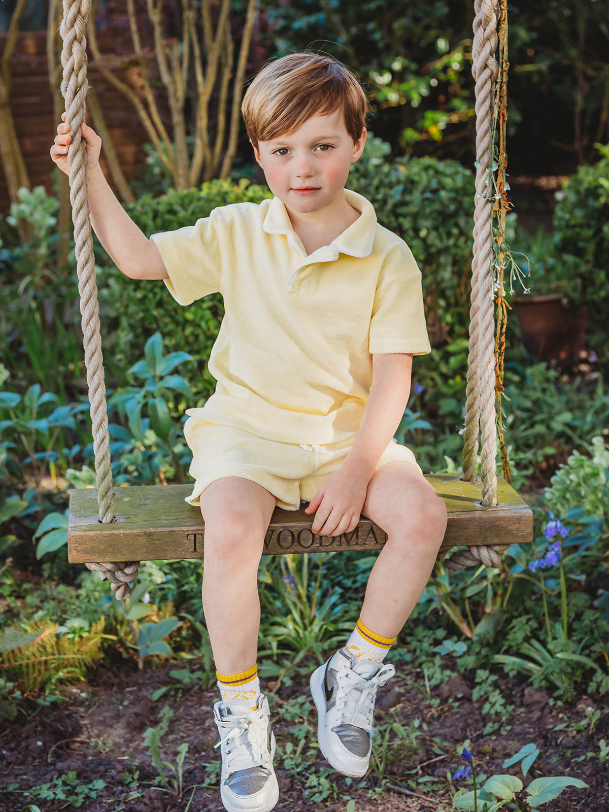 Lemon towelling short set on swing: polo shirt and drawstring shorts