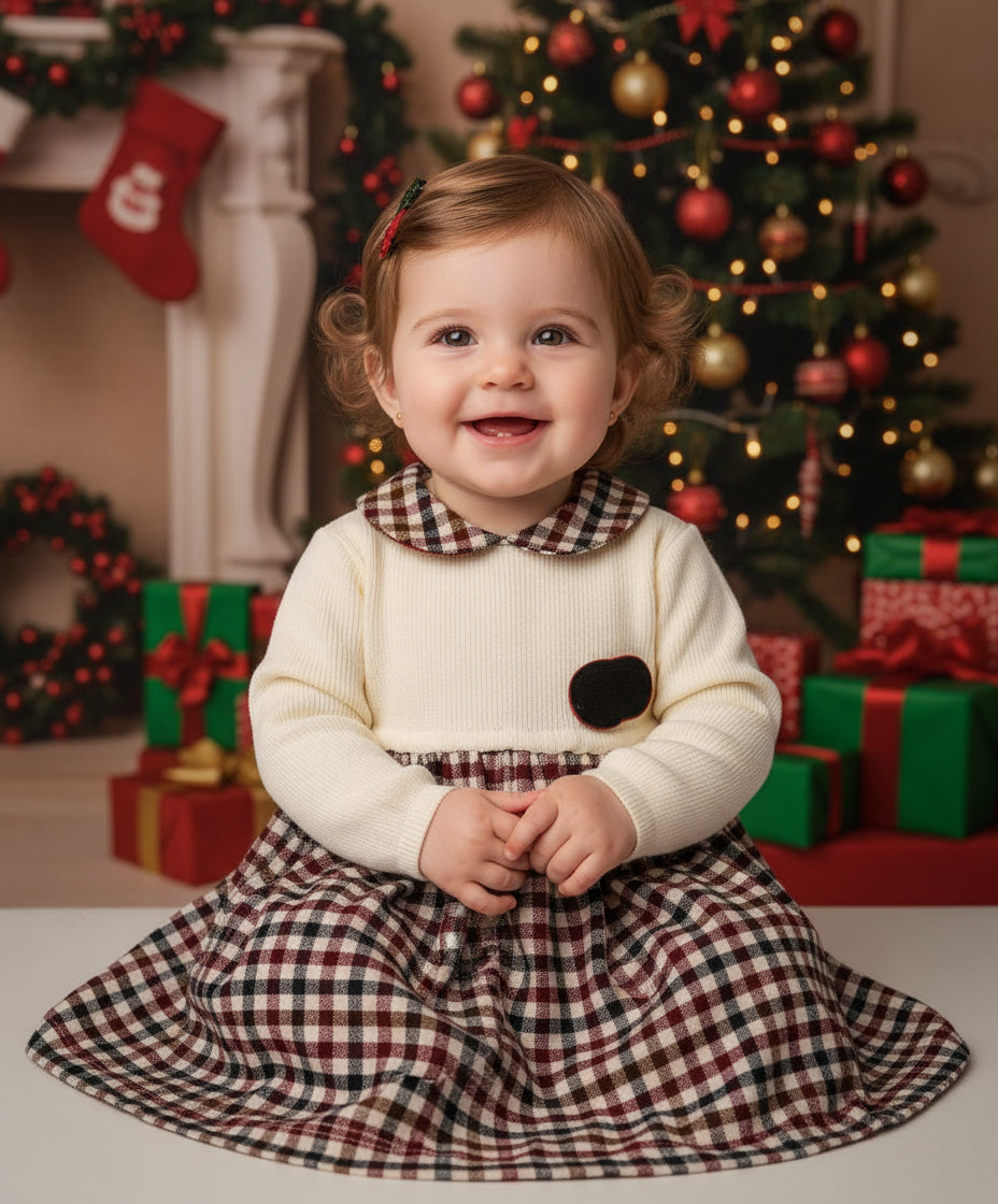 Girls knit dress with cream bodice, dark heart patch, red-green plaid skirt