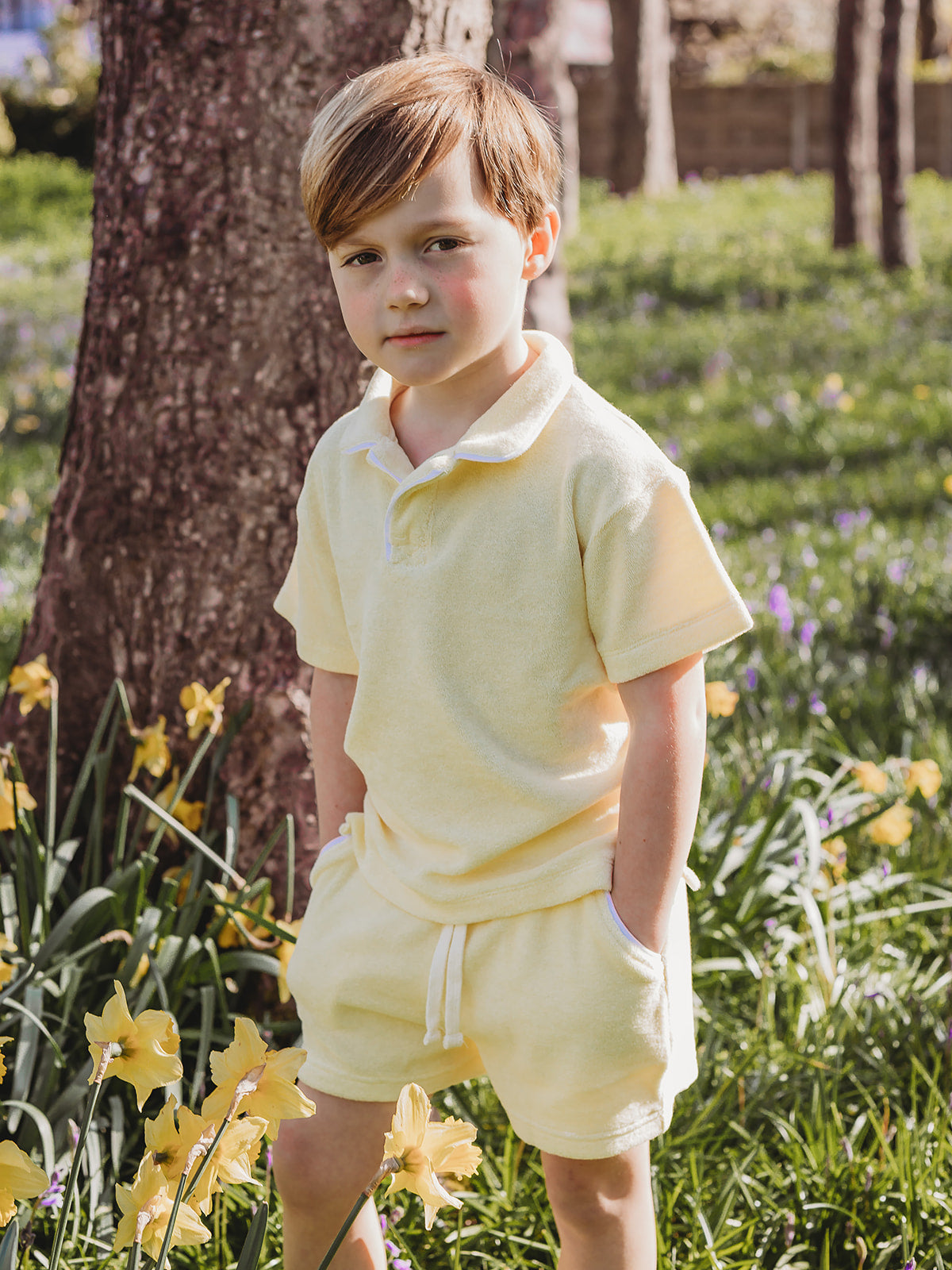 Lemon towelling polo shirt and matching drawstring shorts, side view