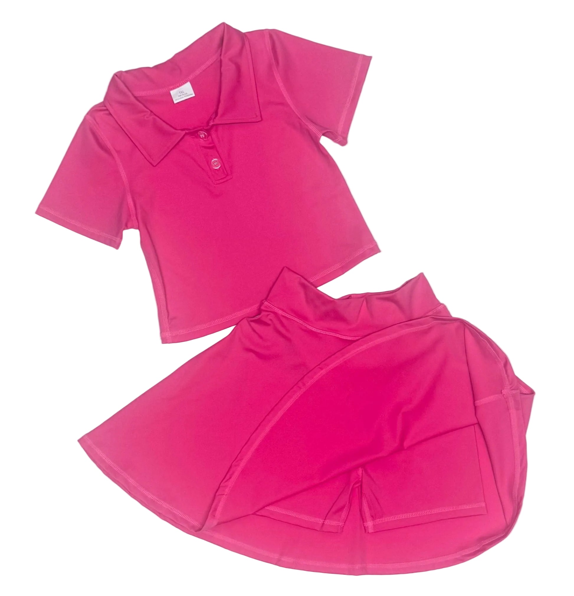 Pink polo shirt and skirt set on a light gray background