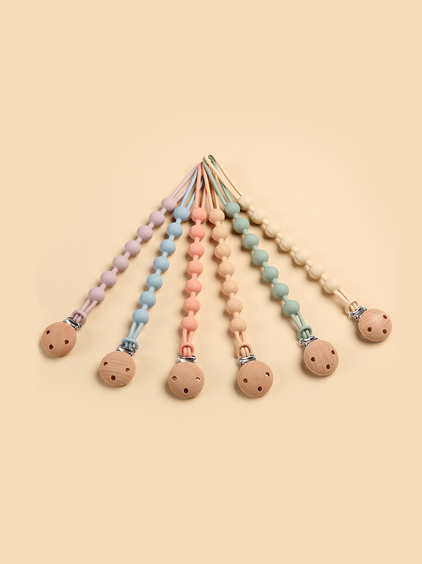 Assorted baby pacifier clips with silicone teether beads and wooden discs