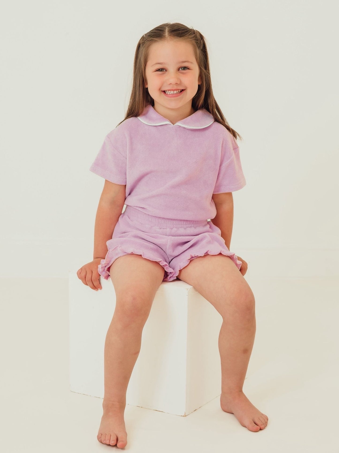 Lilac towelling short set with frilled collar and matching ruffle hem shorts