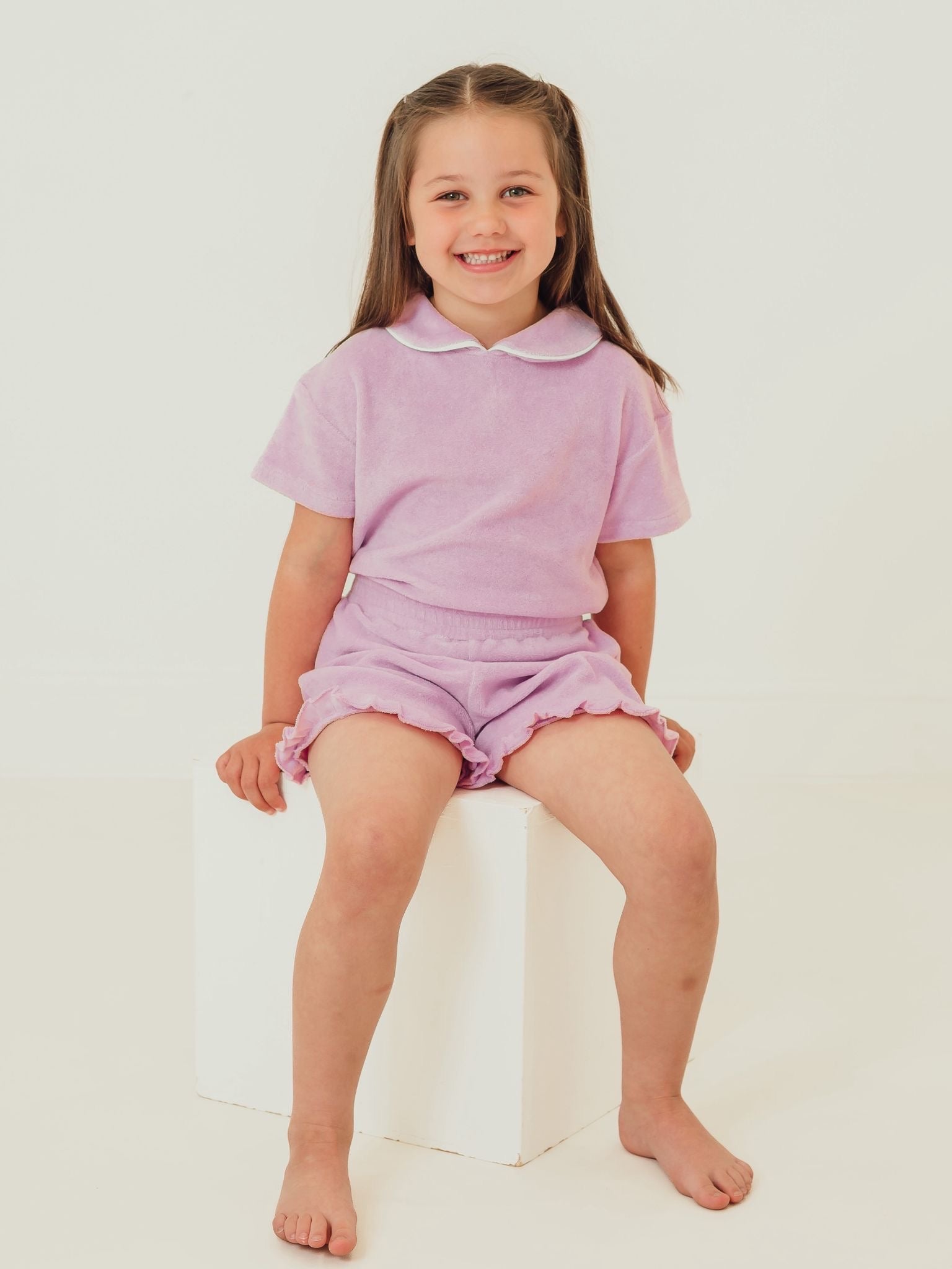 Lilac towelling short set with frilled collar and matching ruffle hem shorts