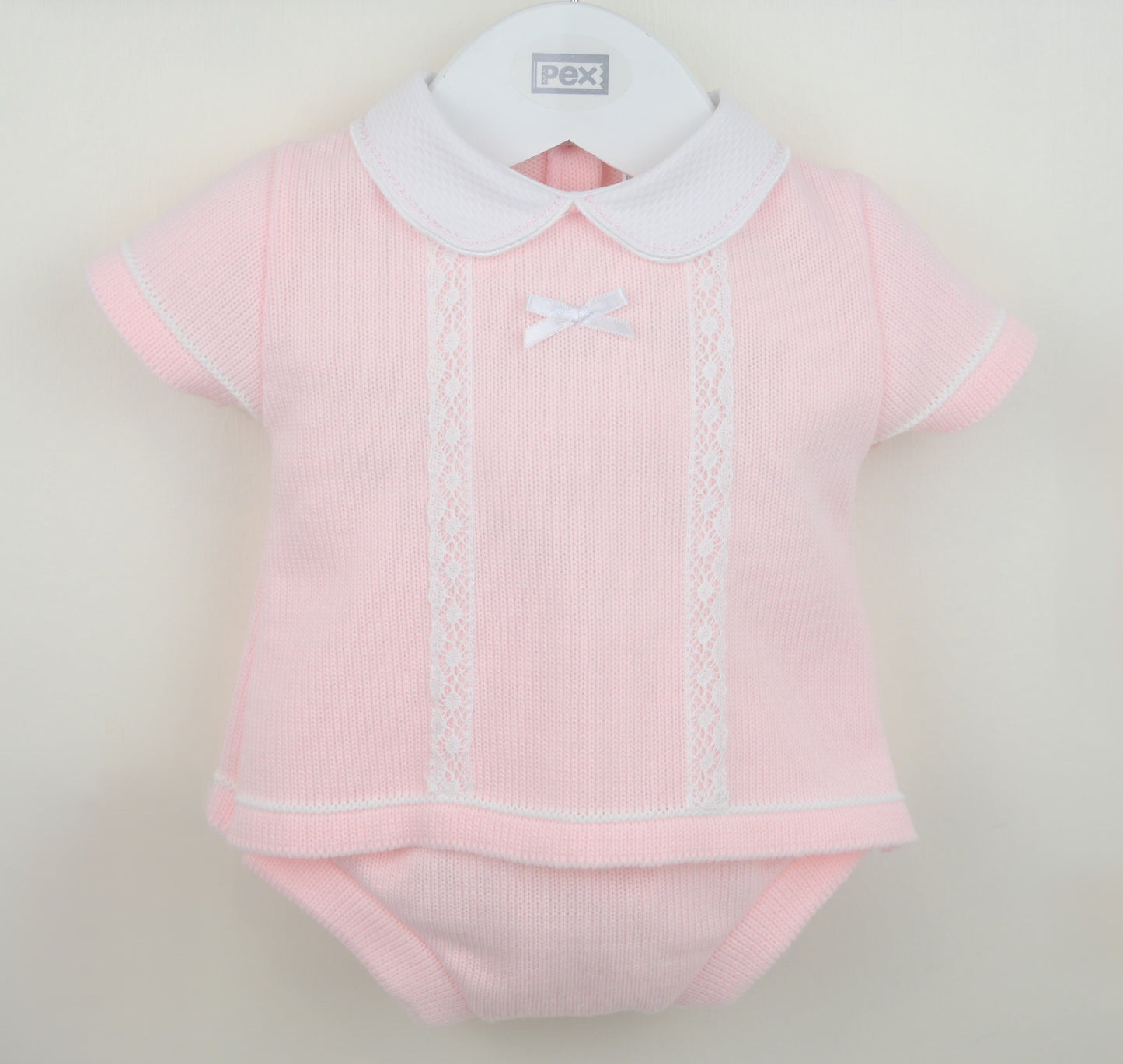 Girls pink knitted jam pants set with white collar, lace trim and bow detail for babies
