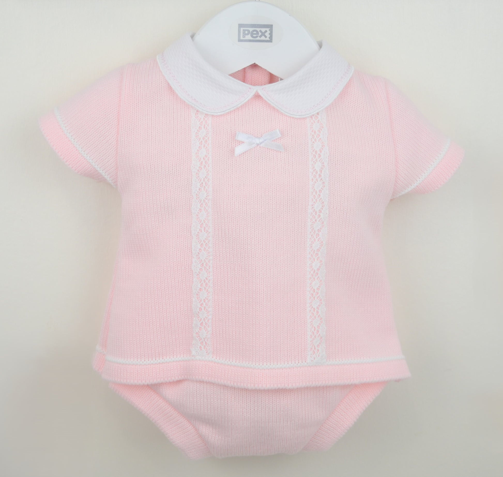 Girls pink knitted jam pants set with white collar, lace trim and bow detail for babies