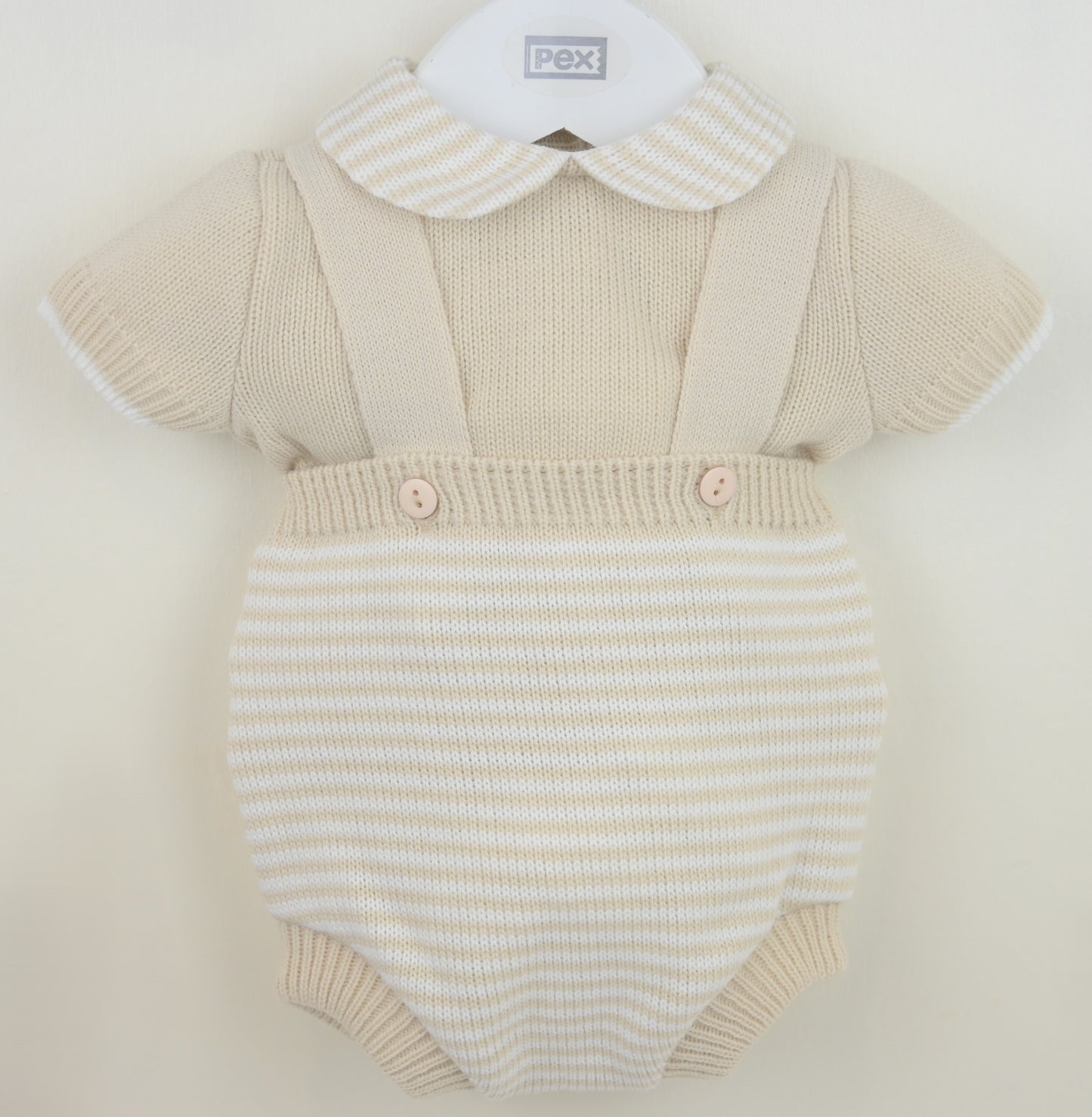 Beige boys knitted baby romper with a collar on a white background