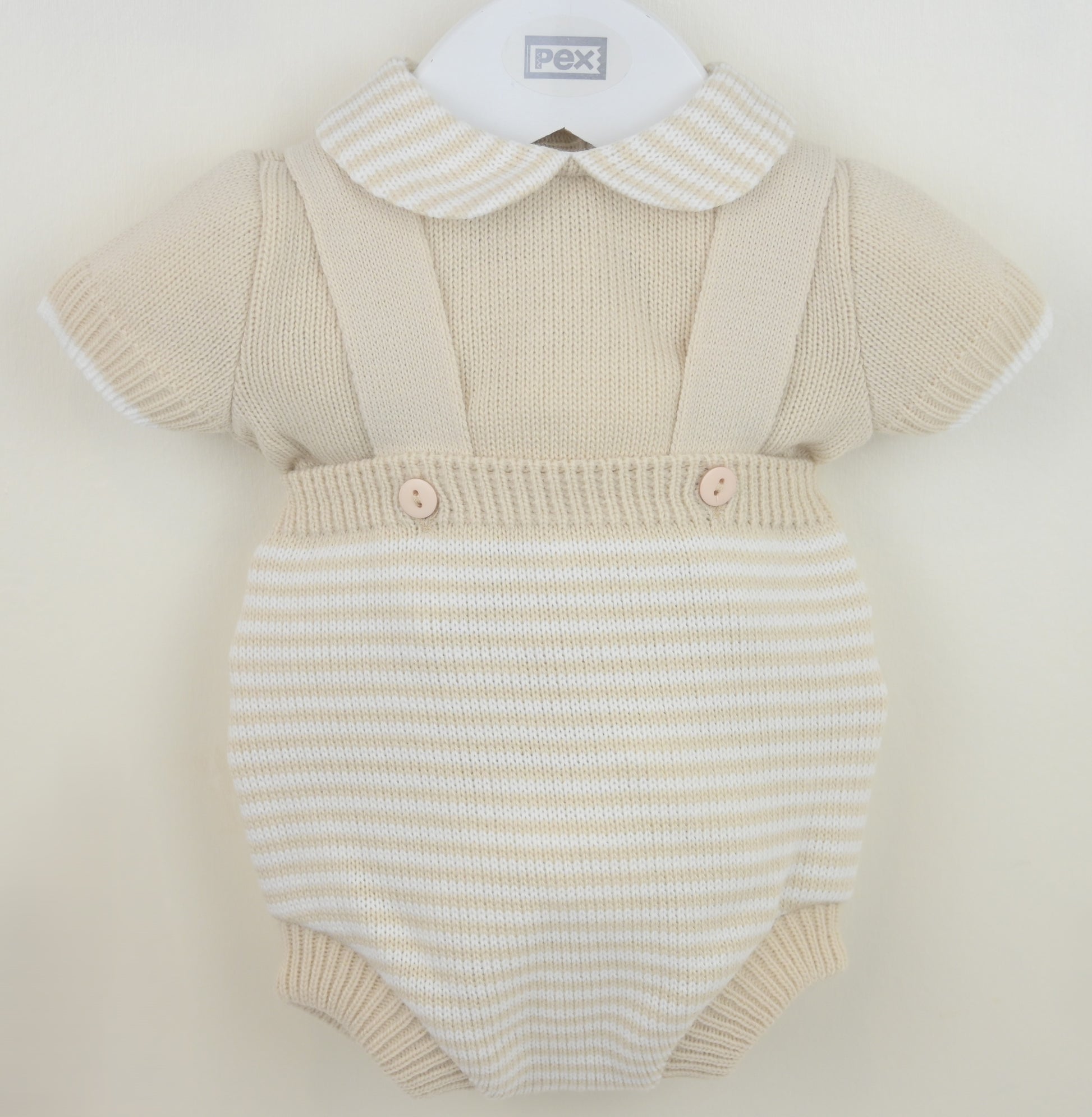 Beige boys knitted baby romper with a collar on a white background