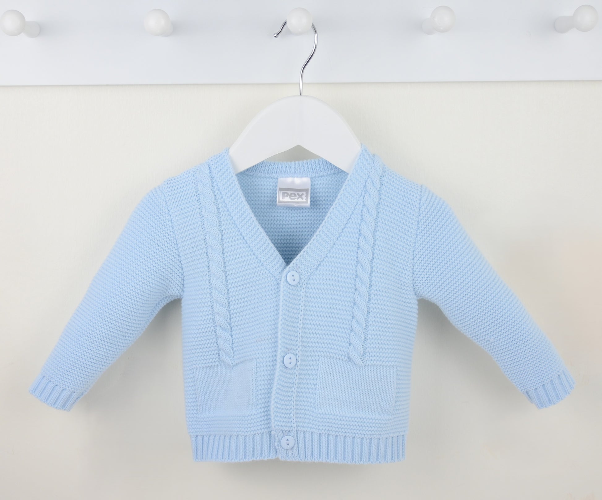 Light blue baby boys toddler boys cardigan on a white hanger against a white background