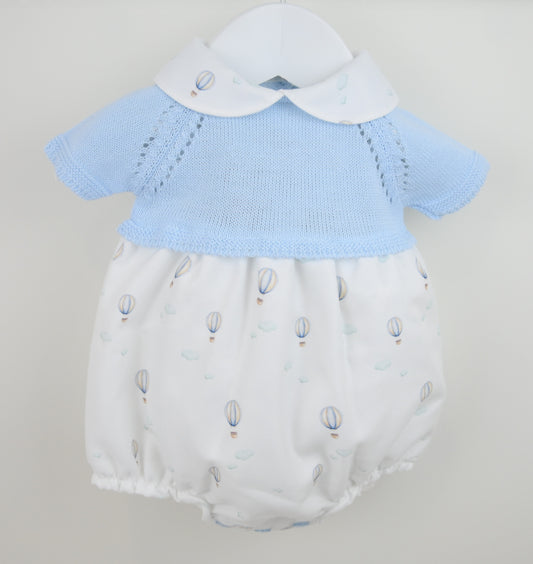 Baby boys romper with blue knit top and white bloomers on a light gray background