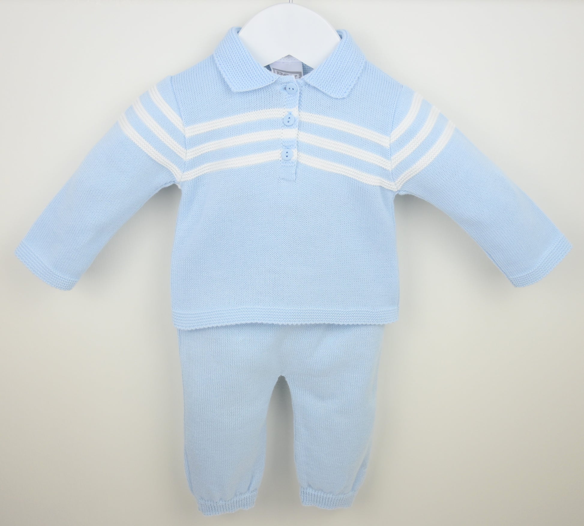 Light blue baby outfit with a striped shirt and pants on a beige background
