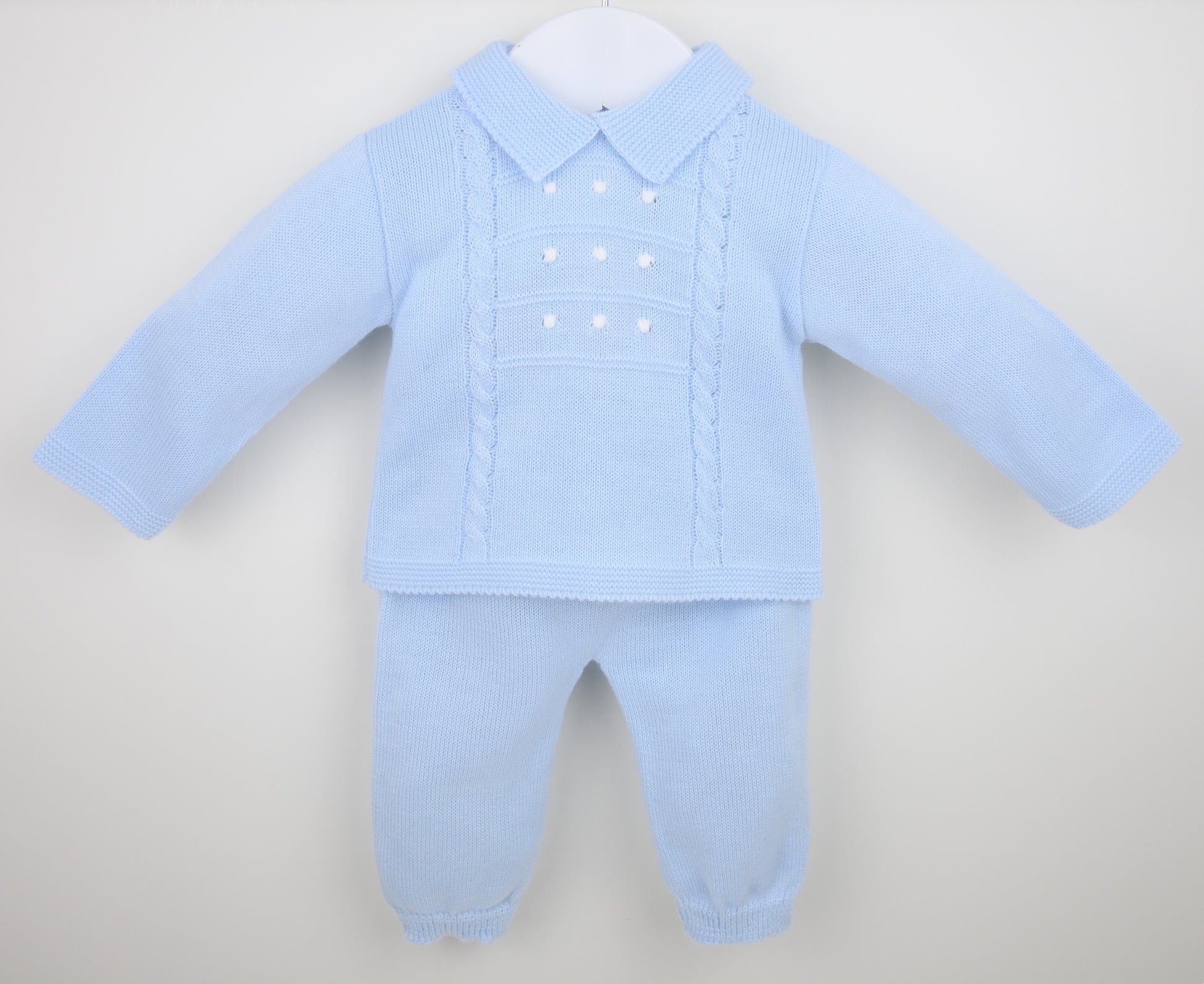 Light blue baby outfit with shirt and pants on a white background