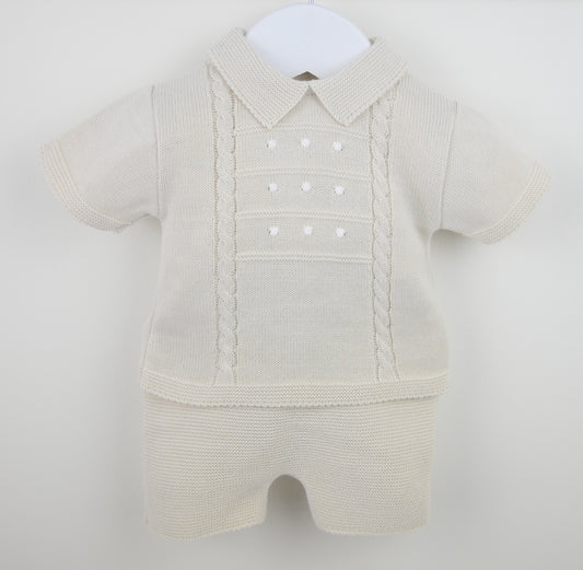 Beige baby romper with a collar on a white background