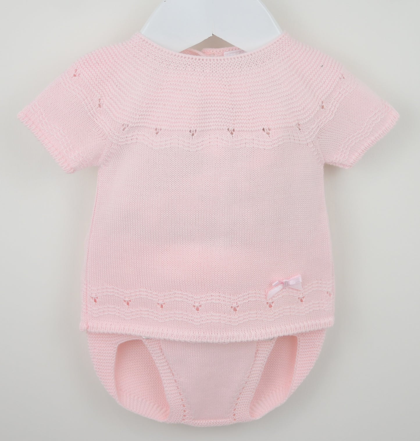 Girls pink knitted jam pants set with satin bow on hanger