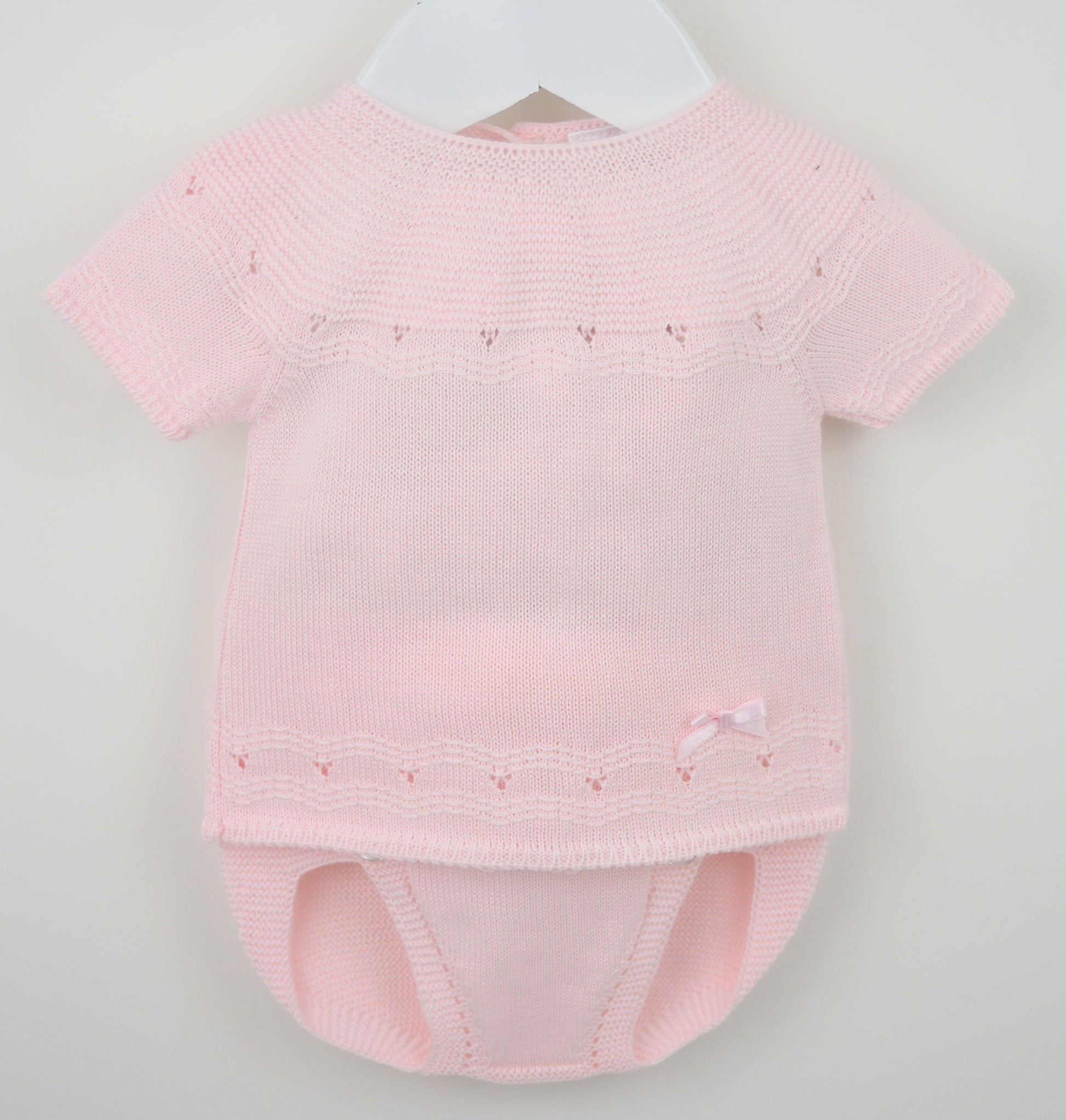 Girls pink knitted jam pants set with satin bow on hanger