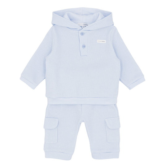 Light blue baby outfit with a hood on a white background
