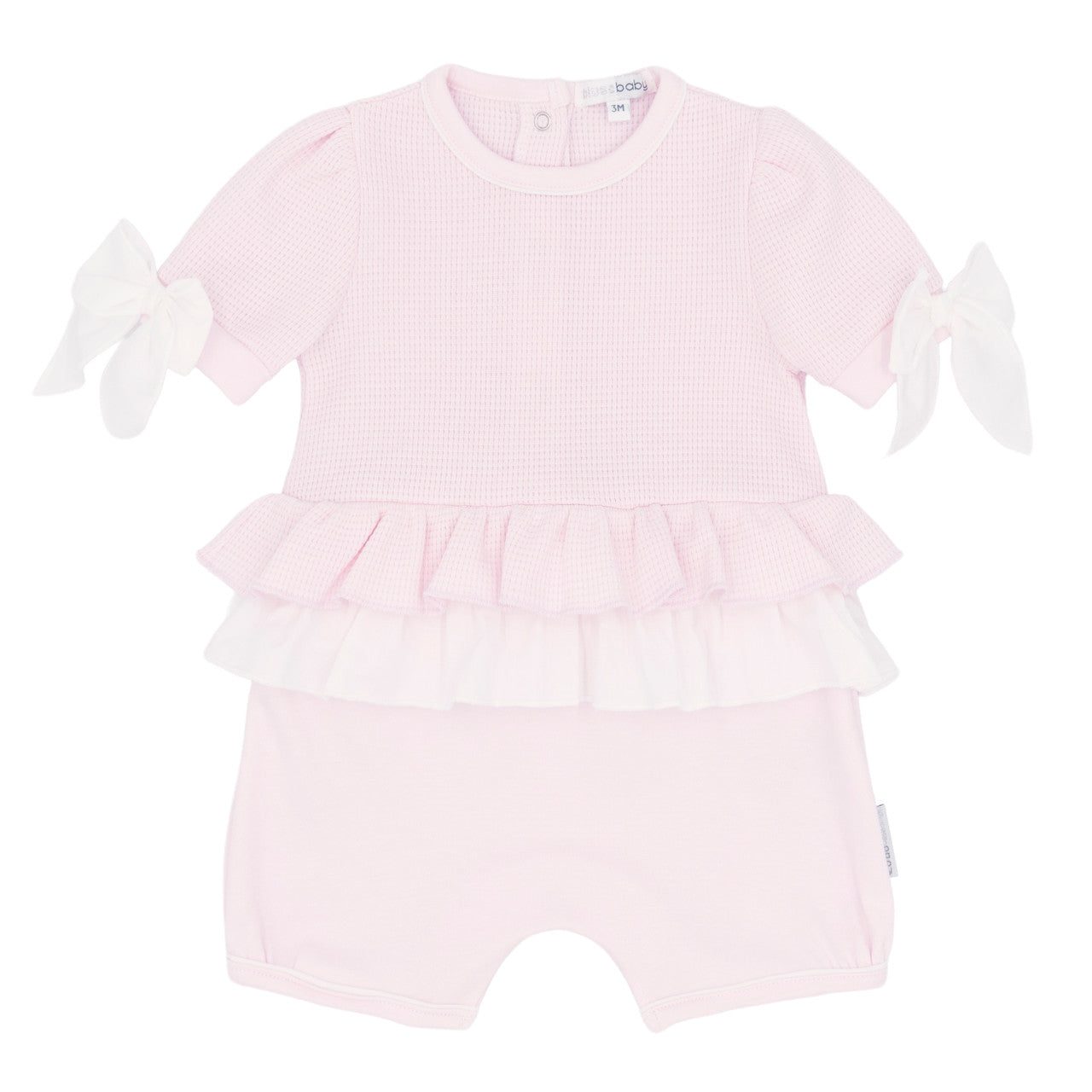 Pink baby romper with ruffled details on a white background