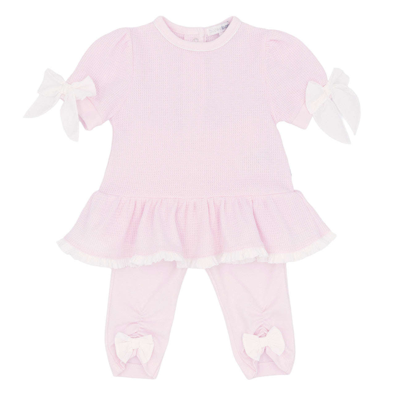 Pink baby dress with white ruffles on a white background