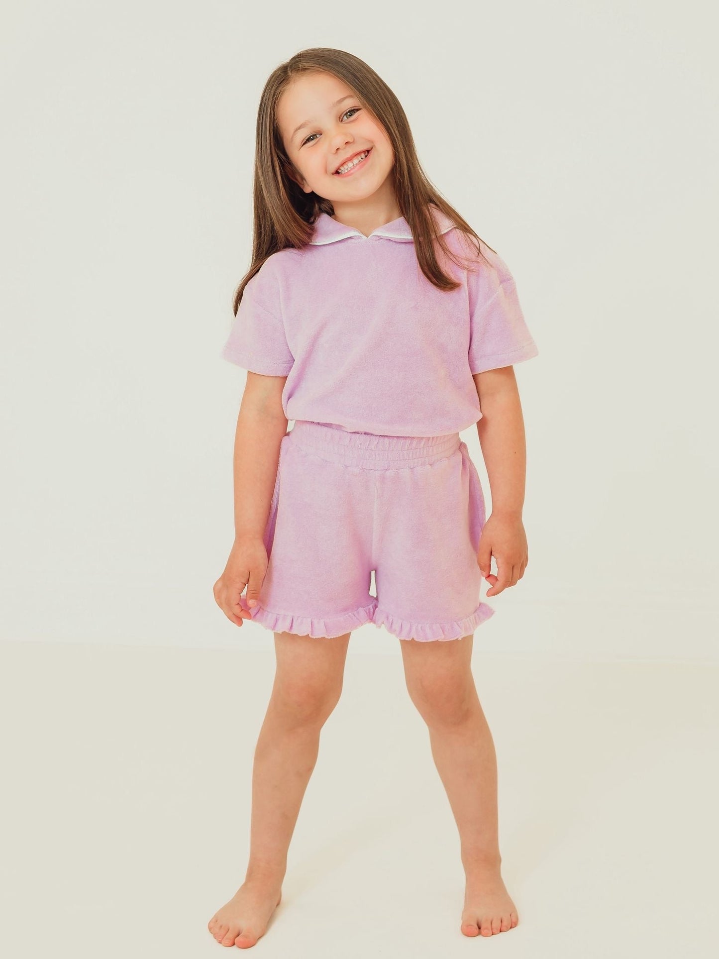Lilac towelling short set with frilled collar and matching ruffle hem shorts