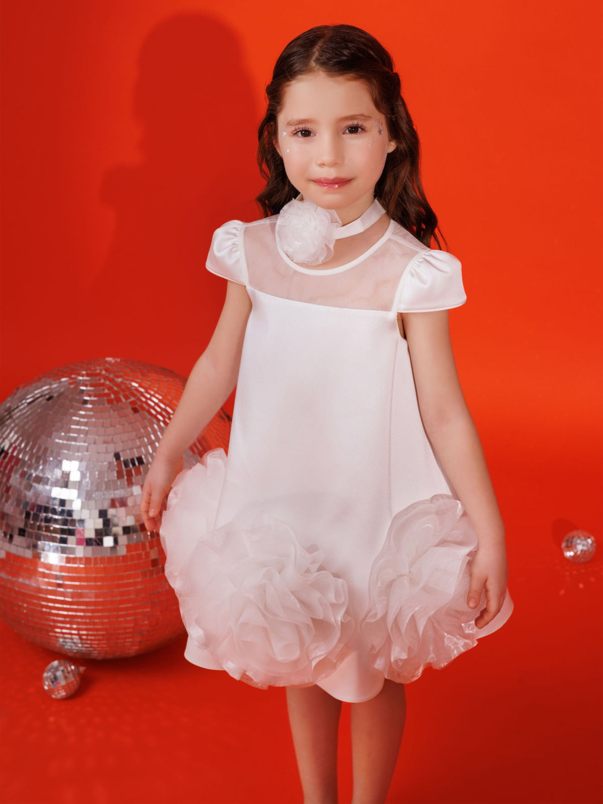 White girls dress with puff sleeves, sheer mesh panel, and flower choker