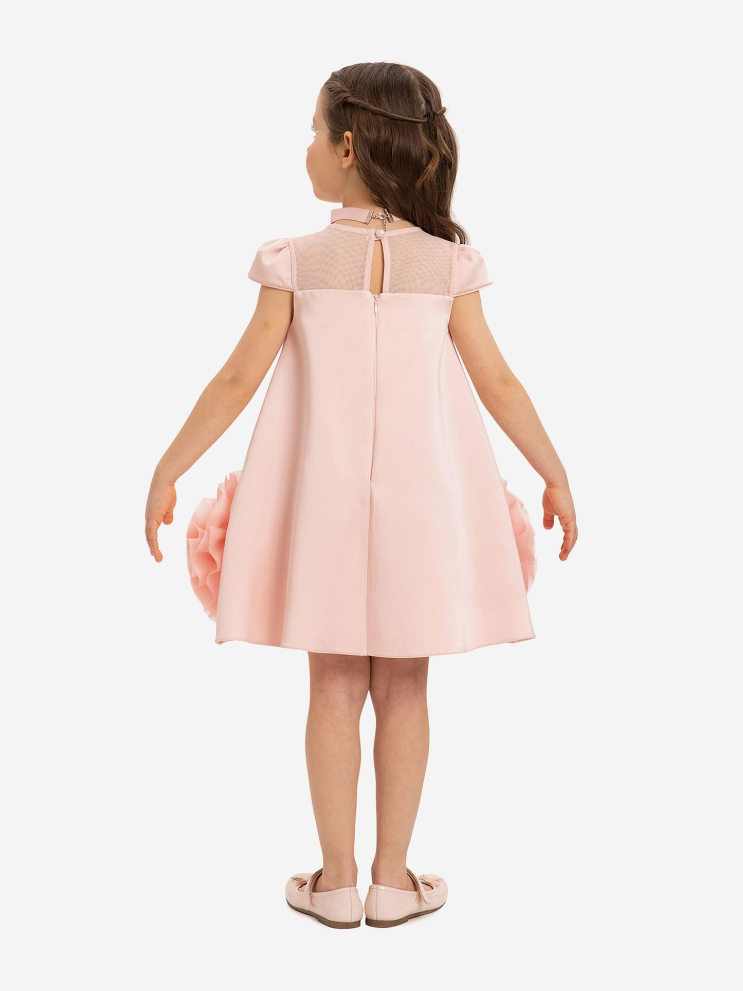 Pink girls’ dress, back view with vertical panel and tulle skirt volume