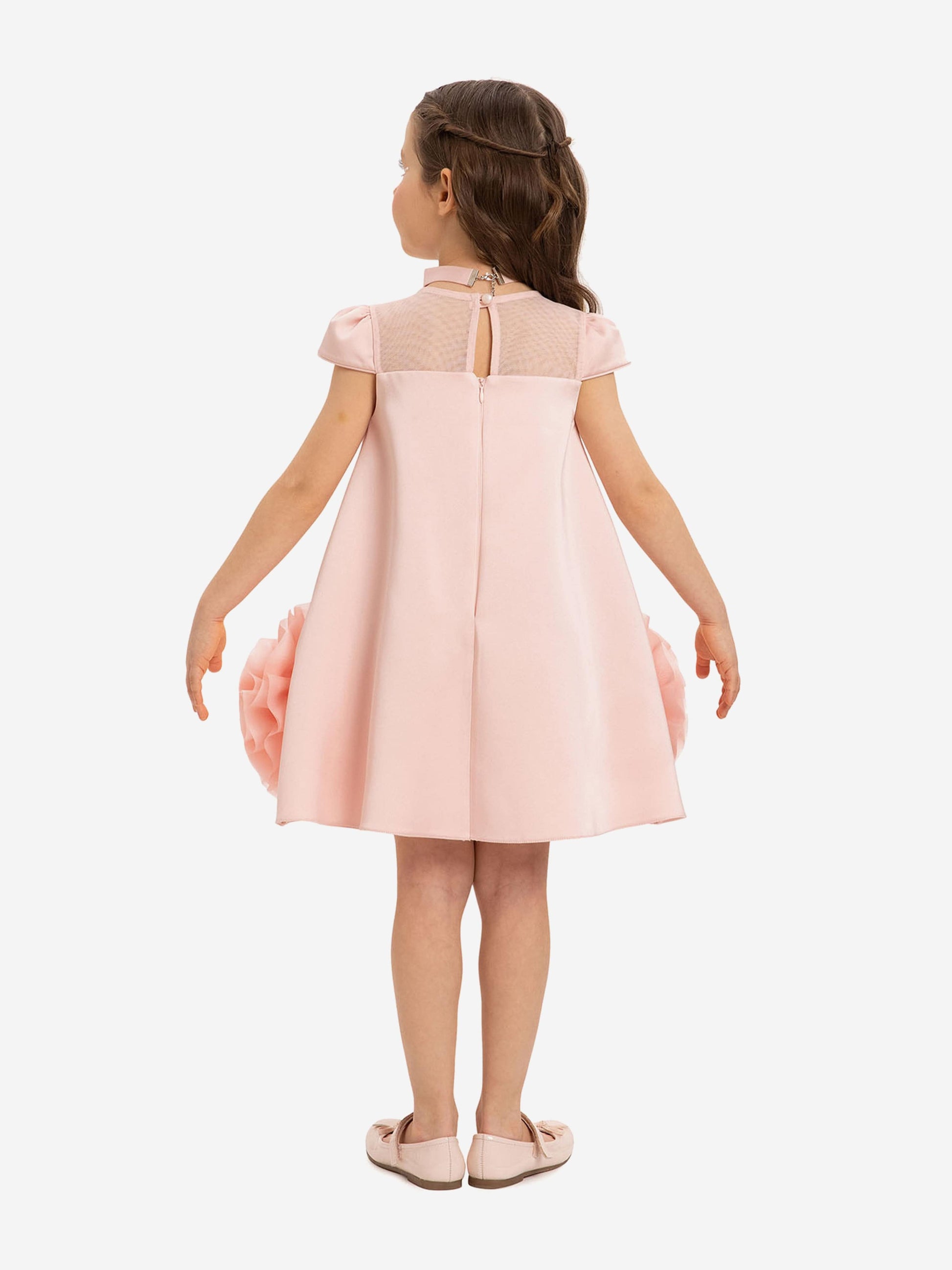 Pink girls’ dress, back view with vertical panel and tulle skirt volume