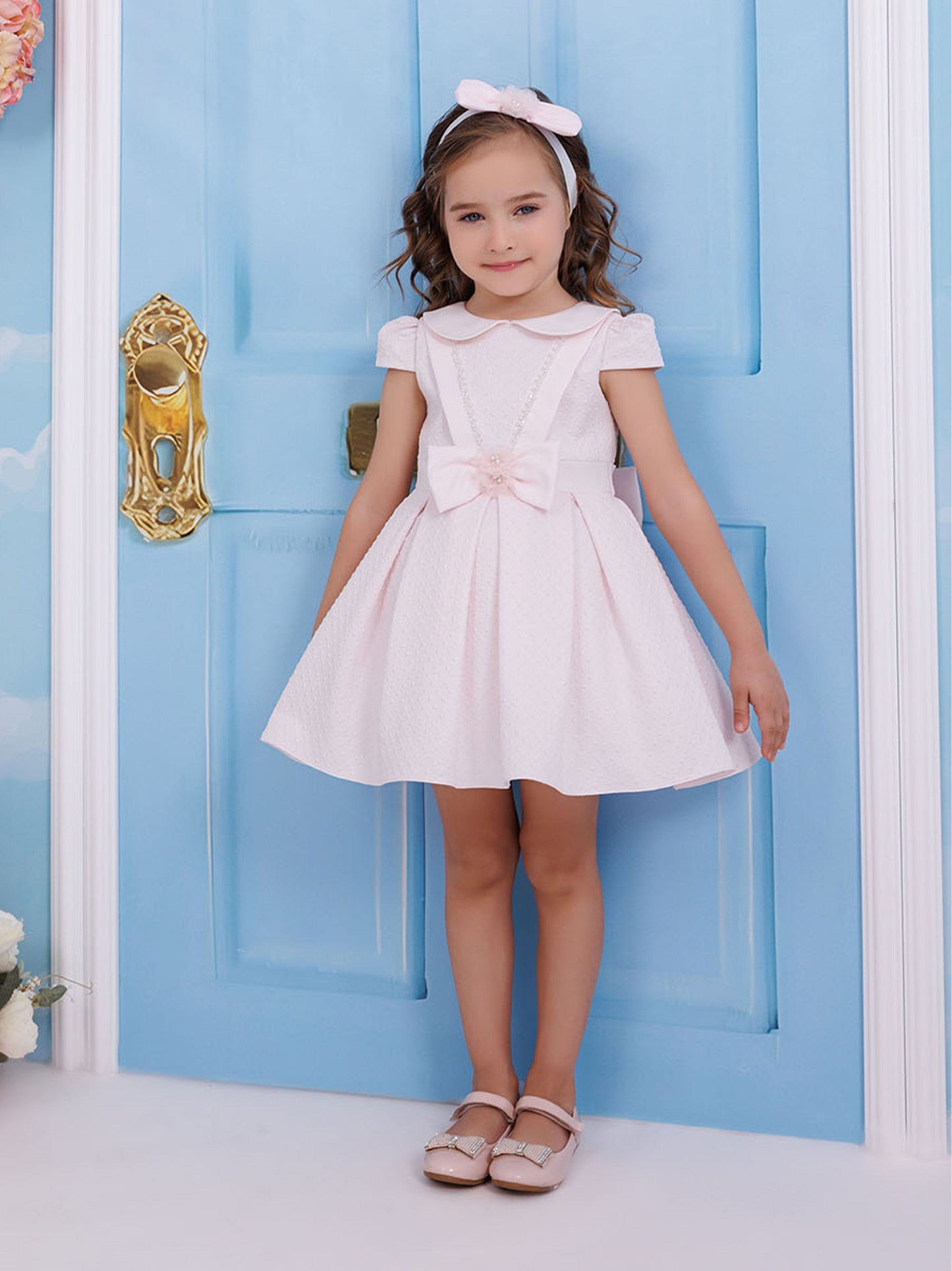 Pink baby girls dress with bow waist and headband, full outfit front view